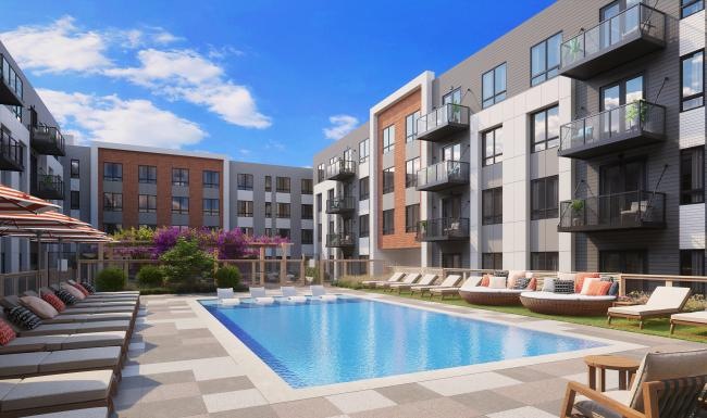 a swimming pool in a courtyard between buildings