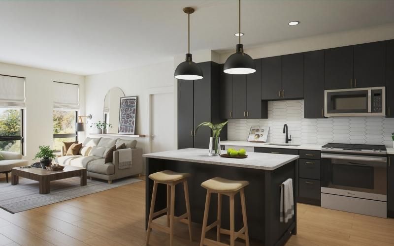 a kitchen with black cabinets